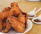 Delicious chicken wings served on a plate with dipping sauce, highlighting the best of Indian and Nepali restaurant offerings.