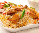 delicious serving of rice and chicken with fresh vegetables, representing the best of Indian and Nepali cuisine.
