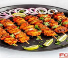 A plate of chicken skewers, showcasing Indian and Nepali cuisine, from a top-rated restaurant offering catering services.