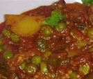 A savory stew with meat and peas, exemplifying the best of Indian and Nepali culinary offerings at a renowned restaurant.